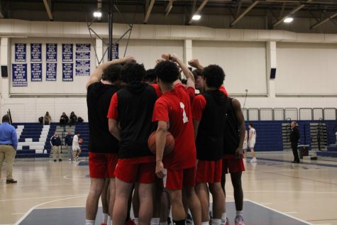 The team huddled up before tip off against Wilton on 1/17/23
